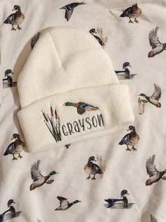 This is a toddler hat.  Personalized Embroidered Mallard beanie hat.  This can be personalized or left without a name- If you want a different thread color for the name please feel free to message me and I will send you options!  Free Shipping :) Fitted Embroidered White Hat, White Flat Bill Hat For Winter, White Winter Flat Bill Hat, White Flat Bill Winter Hats, White Embroidered Fitted Hat, Adjustable Beanie With Embroidered Logo, Embroidered Fitted Cap, Adjustable White Trucker Hat For Winter, Cotton Beanie With Embroidered Logo