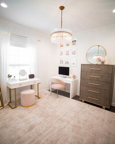 a bedroom with a desk, chair and mirror