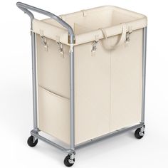 a cart that has two large bins on wheels and one is beige with silver handles