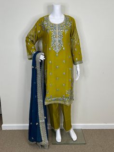 Akbar Aslam Replica Embroidered Pakistani Chiffon dress. Semi Pure Chiffon Embroidered Front, Back, and Sleeves. Semi Pure Chiffon Embroidered Front and Back Borders. Raw Silk Trouser With Embroidery Work. Four Side Border Semi Pure Chiffon Heavy Embroidered Dupatta. Color: There might be slight color variation due to lighting and flashes while the photo shooting. The color may also vary because of different screen resolutions. Wash Care: Dry Clean Only. Note: This is a replica dress of the orig Green Georgette Dresses With Floral Embroidery, Traditional Chiffon Lawn Suit With Resham Embroidery, Yellow Silk Dress With Chikankari Embroidery, Formal Embroidered Yellow Sets, Festive Chiffon Embroidered Fabric, Unstitched Embroidered Chiffon Salwar Kameez, Elegant Embroidered Chiffon Salwar Kameez, Elegant Yellow Lawn Suit With Floral Embroidery, Festive Embroidered Chiffon Dupatta