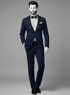 Enriching the edge of glamour by pulling off our Napolean Etizi Wool Tuxedo Suit is your sure advantage of staying on point. Gorgeously exude sophistication with this piece, crafted from a wool blend, which emphasizes a subtle, splendid smoothness, and a serene tone with stripes pattern over a blue tint develops modern twists on classical aesthetics. Adorn masterclass in relaxed elegance with an impeccably tailored blue tuxedo suit that conveys confidence while maintaining sharp and generous convenience to emerge in exotic situations and charming occasions.  Featuring satin lapel, matching satin covered buttons and gentle texture at its surface, our tuxedo is a subtle fashion-forward take on a traditional tailoring.  Look Includes   Napolean Etizi Wool Fabric  Two Button Tuxedo Jacket Styl Formal Fitted Suit With Structured Boning, Elegant Fitted Wool Tuxedo, Elegant Wool Tuxedo, Bespoke Fitted Evening Suits, Designer Fitted Suits For Formal Occasions, Luxury Party Suits In Suiting Fabric, Fitted Timeless Blazer For Parties, Luxury Fitted Tuxedo With Structured Boning, Designer Fitted Tuxedo For Semi-formal Occasions