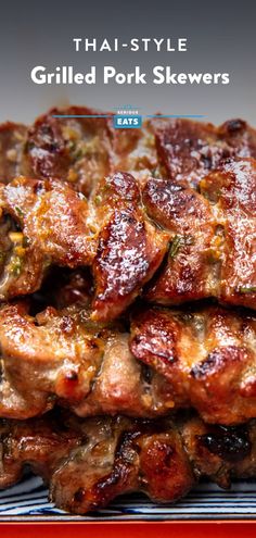 grilled pork skewers are stacked on top of each other