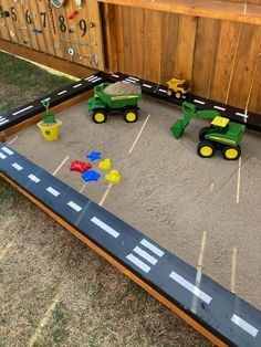 a play area with toys in the shape of tractors