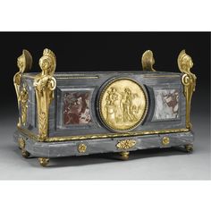 an ornately decorated box with gold and marble decoration on it's sides,