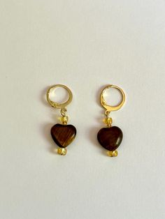 These handcrafted earrings are the perfect blend of style and sophistication, designed to elevate your look no matter the occasion. Each pair is carefully made by hand, featuring [describe key elements, such as gemstones, beads, metal accents, etc.] that bring a unique and artistic touch to every piece. Whether you're dressing up for a night out or adding a pop of personality to your everyday wear, these earrings are sure to make a statement. Crafted with high-quality materials like 14k gold plated hoops and tigers eye stone, these earrings are lightweight and comfortable for all-day wear. They make a thoughtful gift for birthdays, anniversaries, or just because. Key Features: Handmade, one-of-a-kind design Materials: 14k gold plated hoops, Tigers eye stone Lightweight and comfortable Perf Handmade Huggie Earrings As Gift, Handmade Brown Clip-on Earrings As Gift, Brown Teardrop Hoop Earrings As Gift, Brown Teardrop Hoop Earrings For Gift, Brown Teardrop Hoop Earrings For Gifting, Handmade Dangle Huggie Earrings For Gifts, Handmade Brown Jewelry For Valentine's Day, Handmade Small Hoop Clip-on Earrings As Gift, Handmade Small Hoop Clip-on Earrings For Gift