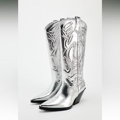 New With Tag Cowboy Boots With Metallic Effect. Textured Detail At Shaft. Side Pull Tabs. Pointed Toe. Heel Height: 2.8 Inches (7 Cm) Upper 100% Polyurethane Lining 90% Polyester 10% Polyurethane Sole 100% Sbs Insole 100% Polyester Silver 3095/310 S251 Trendy Silver Summer Boots, Silver Casual Boots With Pointed Toe, Silver Casual Boots For Spring, Casual Silver Boots For Spring, Trendy Zara Knee-high Boots, Zara Trendy Knee-high Boots, Silver High Ankle Boots For Spring, Metallic Cowboy Boots, Bota Cowboy