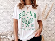 Bel-Air Tennis Club Shirt Preppy Tennis Shirt Unisex Sports T-shirt Vintage California Tennis Shirt Tennis Gifts Preppy Bachelorette Shirt Please allow 3-5 days for processing plus 4-6 days for shipping This classic unisex jersey short sleeve tee fits like a well-loved favorite. Soft cotton and quality print make users fall in love with it over and over again. These t-shirts have-ribbed knit collars to bolster shaping. The shoulders have taping for better fit over time. Dual side seams hold the Preppy Bachelorette, Bachelorette T Shirt, Bachelorette Tshirts, Tennis Shirt, Tennis Tshirts, Tennis Gifts, Tennis Club, Tennis Clubs, Tennis Shirts