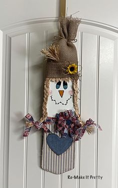 a door hanger with a scarecrow on it