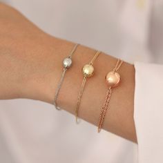 "◖ A B O U T ◗ The Engraved Ball Urn Bracelet, available in 14k and 10k gold, is a truly meaningful and exquisite jewelry. A delicate gold ball urn charm on this bracelet is ideal to store a modest reminder of a loved one, such as ashes. It's a lovely and inconspicuous way to keep a special memory close to your heart. The charm can be engraved with a name, date, or special message, making this bracelet a one-of-a-kind and poignant memorial. Its design strikes a balance between the urn's tragic f Elegant Adjustable Bracelet With Shiny Finish, Hallmarked Rose Gold Bracelets, 14k White Gold Jubilee Bracelet, Elegant Engraved Round Chain Bracelet, Elegant Bracelets With Shiny Finish For Gifts, Elegant Round Engraved Chain Bracelet, Rose Gold Polished Bracelets As Gift, Classic Sterling Silver Bracelet In Yellow Gold For Gift, Rose Gold Polished Bracelet For Gift