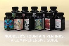 a group of ink bottles sitting next to each other on top of a table with the words noodler's fountain pen inks