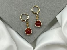 Save when you shop through my website, I'd appreciate it 💚- https://shorturl.at/dGU49 *PLEASE NOTE:  The picture displayed is for reference. Please be advised your chosen crystals will vary slightly. However, they will be equally as beautiful & powerful* 💓 Lovingly Handmade tarnish resistant carnelian drop earrings in gold 💓 ✨ 8mm crystal beads  Benefits of Carnelian 🧡 🧡 Fill your life with passion, creativity and confidence.  🧡 The crystal of creativity, Carnelian's fiery energy also brin Carnelian Earrings Gold, Nickel-free Agate Earrings For Gifts, Carnelian Wire Wrapped Earrings As Gift, Carnelian Wire Wrapped Earrings For Gift, Gift Carnelian Wire Wrapped Earrings, Adjustable Carnelian Dangle Earrings, Adjustable Carnelian Earrings With Natural Stones, Handmade Adjustable Carnelian Earrings, Carnelian Teardrop Earrings For Gift