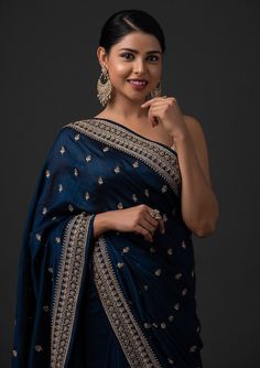 COLOR : Oxford Blue & Beige Gold FABRIC : Saree - Art Silk, Blouse - Gota WORK : Dori Work, Stones, Sequins & Lace BorderOCCASION : Wedding, Engagement, Party Wear, Festival, Sangeet NOTE : The outfit includes blouse and saree only. Petticoat is not included. READY-TO-WEAR : No STITCHING : Available as semi-stitched fabric, can be stitched using standard size option (+$20). Note: There might be a slight color variation due to lighting and flash used during photoshoot. The bright shade seen is th Navy Blue Saree, Blue Silk Saree, Set Saree, Navy Blue Blouse, Saree Designs Party Wear, Oxford Blue, Blue Saree, Embroidery Saree, Art Silk Sarees