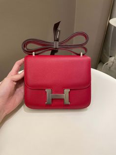 Hermes Constance 18Rouge Casaque Epsom PHWSize 18 x 14 x 5cmQ Square Stamp9-9.5/10 Excellent (minimal faint leather scratches and underflap hardware signs otherwise excellent)Includes dust bagPrice was 12,200 sgdPrice now 11,700 sgd 8880 usd CN5842-04 Hermes Bags Constance, Hermes Constance, Dior Shoes, Louis Vuitton Shoes, Vuitton Bag, Exclusive Bag, Beautiful Packaging, New Bag, Fashion Statement