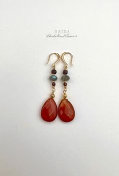 Carnelian Teardrop and Labradorite with Garnet Gold Earrings | Natural Carnelian Gold Filled Earrings | Carnelian Drop Earrings | Carnelian Earrings | Orange Stone earrings 14K Gold Filled on sterling silver ear wires Drop length 6 cm, stone diameter 18mm x 14mm, Carnelian have a beautiful shades of orange-red, The labradorite gemstones have amazing flashes of colour  Natural Carnelian has an inclusions, patterns, and cloudy patches within the gemstone, the shade of colours vary from piece to piece. This means your earrings will be completely unique These earrings are simply sweet and elegant, a gorgeous accessory for any lover of minimal jewellery and gemstones.  Carnelian restores vitality and motivation, and stimulates creativity. It gives courage, promotes positive life choices, dispel Carnelian Gemstone Dangle Earrings, Carnelian Dangle Earrings With Natural Stones, Carnelian Natural Stones Dangle Earrings, Red Carnelian Teardrop Earrings, Red Carnelian Gemstone Earrings, Amber Carnelian Teardrop Earrings, Carnelian Earrings, Pearl Headpiece, Gold Headpiece