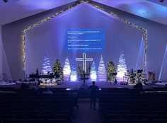 a man standing in front of a church stage