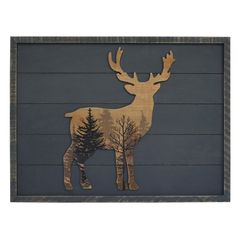 a deer with trees painted on it's back is standing in front of a wooden wall