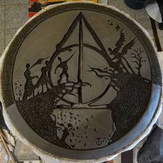 a ceramic plate with an image of people on it