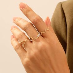 The Plain X Ring is made with a genuine design so that you could wear it with confidence in any environment you wish to be present. Its particular design will make you look more elegant than usual and induce all the eyes around you to stare at your minimalist beauty. - Made in 14k solid gold - Band Width: 1.07 mm / 0.04 inches - Ring Width: 8.00 mm / 0.31 inches - Thickness: 1.20 mm / 0.04 inches - This product comes with iconic Norm Jewels gift box Modern Adjustable Diamond Ring With Open Band, Adjustable Modern Open Band Diamond Ring, Modern Adjustable Open Band Diamond Ring, Adjustable Modern Diamond Ring For Formal Occasions, Modern Adjustable Diamond Ring For Everyday, Modern Adjustable Open Diamond Ring, Minimalist Adjustable Diamond Ring, Elegant Adjustable Infinity Midi Rings, Modern Infinity Rings For Everyday