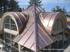 a large metal roof on top of a building