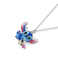 Featuring a beloved cartoon character, this necklace can be an eye-catching addition to most outfits. Crafted in sterling silver with red enamel ears, the adorable extraterrestrial holds a heart-shaped arrow. Be love-struck by extraterrestrial with this adorable necklace.Carat Weight: 0.145 ctStone Size: 3*3 mmStone Type: Jeulia® StoneNumber of Stones: 1 Stone Color: FuchsiaStone Shape: HeartWeight: 4 gWidth: 22.4 mmHeight: 18.5 mmThickness: 8.2 mmMaterial: 925 SilverPlating Color: Silver, Yello Enamel Pendant Charm Necklace With Adjustable Chain, Enamel Jewelry With Adjustable Chain, Disney Heart Shaped Jewelry Gift, Disney Heart-shaped Jewelry Gift, Disney Sterling Silver Jewelry In Silver, Themed Heart-shaped Jewelry Gift, Silver Enamel Heart Pendant Necklace, Playful Adjustable Silver Necklace, Silver Enamel Jewelry With Adjustable Chain