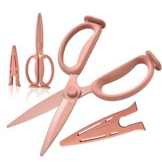 a pair of pink scissors and shears on a white background