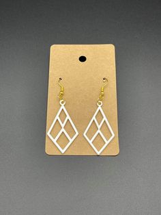 "Beautiful 3D printed custom earrings.   Size: 1.77\" tall x 0.98\" wide. Material: PLA plastic. Color: Multiple available Material: Made out of PLA plastic which is made out of corn and fermented plant starch.  How it's made: All products are made by me with a 3D printer.  Each item is made to order.  Meaning when you place an order, your item is made on demand specially for you.  Made in the California, USA. not a print farm or over seas. Since the item is 3D printed, there is a process of man Modern White Geometric Earrings, Modern White Earrings With Ear Wire, White Laser Cut Earrings As A Gift, White Laser Cut Earrings For Gift, White Laser-cut Jewelry For Gifts, White Pierced Drop Plug Earrings, Boho Style Earrings, Custom Earrings, Wedding Jewelry Earrings