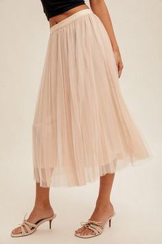 Women's Mesh Pleated Skirt Ballerina Midi Skirt This Ballerina Midi Skirt comes in both white and black, giving you the perfect versatile look. With its multiple layers and lined design, it's perfect for achieving a cute and flowy look. Plus, the elastic band adds a touch of ballerina vibes to this adorable midi skirt. Details Available in sizes: S-L Available in colors: White and Black Layered Lining Mesh Pleated Midi skirt Elastic band Fabric 100% Polyester Sizing Small: 2/4, Medium: 6/8, and Chic Stretch Pleated Tiered Skirt, Elegant Stretch Pleated Tiered Skirt, Chic Tulle Flared Maxi Skirt, Chic Flared Tulle Maxi Skirt, Party Pleated Skirt With Elastic Waistband, Feminine Pleated Skirt Bottoms For Party, Flowy Pleated Skirt With Elastic Waistband For Party, Chic Stretch Tulle Maxi Skirt, Spring Relaxed Tulle Pleated Skirt