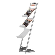 a three tiered magazine rack with magazines on it's sides and the words retro font