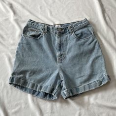 Vintage 1990s high waisted Calvin Klein shorts in medium wash denim. In good vintage condition. Note: I try to match colors as much as possible to pictures but there is a possibility it won't be an exact match. Unless the color is completely incorrect I am unable to offer refunds for this reason. Size: 12 Brand is Calvin Klein Measurements (taken on garment laid flat): Waist: 30" Hips: 43" Rise: 13" Inseam: 4.5" Fabric: 100% cotton Cheap Blue Levi's Shorts, Vintage High-waisted Jean Shorts For Spring, Vintage Medium Wash Summer Shorts, Vintage Medium Wash Shorts For Summer, 90s Inspired Light Wash High Waist Bottoms, Retro High-waisted Light Wash Jean Shorts, Retro High Waist Medium Wash Shorts, Retro High-waist Medium Wash Shorts, High Rise 90s Inspired Summer Shorts