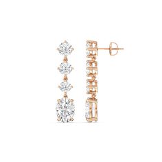 These diamond danglers exude a sense of sophistication and ease. They look relaxed and refined at once with their linear design and subtle movement. Each earring features a trio of round diamonds set in a vertical row and punctuated by a larger oval-cut diamond at the end. This elegant pair is the perfect choice when you want to dress to impress yet still be comfortable. Diamond Danglers, Round Diamond Setting, Dangler Earrings, Linear Design, Gorgeous Engagement Ring, Oval Cut Diamond, Diamond Shop, High Quality Jewelry, Metal Rings