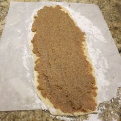 a piece of paper that has some kind of food on it, sitting on a counter