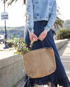 The perfect grab & go bag for library runs, farmers markets, day trips or groceries, these jute shopping bags have been handwoven by women working within a Fair Trade program in Bangladesh. These talented women combine traditional weaving styles using wooden looms with contemporary designs and natural materials. The bags feature strong handles made of the same handwoven material. Weaving Styles, Jute Shopping Bags, Women Working, Go Bag, Sustainable Shopping, Straw Handbags, Farmers Markets, Go Bags, Traditional Weaving