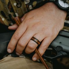 The Yooper is inspired by the intrepid outdoorsmen who inhabit and explore the Upper Peninsula of Michigan. This black tungsten wood ring features a genuine koa wood inlay, as well as a matte textured finish top and beveled, polished edges. Ring Engraving Available. Available in widths 4mm & 6mm Matching Band For Her. Specifications Crafted out of tungsten carbide Inlaid with genuine koa wood Beveled edges Comfort-Fit Width: 8mm 100% Waterproof High Scratch-Resistance Includes ring box Shipp Woodland Wedding Ring, Koa Wood Ring, Gold Stacking Rings Wedding, Unusual Wedding Rings, Ring Engraving, Carbon Fiber Rings, Wooden Wedding Ring, Wood Wedding Ring, Men's Wedding Bands