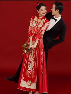 This stunning Qun Kwa is a traditional Chinese wedding dress, featuring a rich red color that symbolizes good luck, happiness, and prosperity. The dress is intricately embroidered with golden phoenix motifs, which are symbols of femininity, grace, and harmony in Chinese culture. Made from satin fabric, ensuring both comfort and elegance. Pair it with a dragon tang suit (ma gua), representing the perfect balance between yin and yang Size Guide: Please refer to the size guide picture before placin Qun Kwa, Chinese Wedding Dress Traditional, Golden Phoenix, Traditional Chinese Wedding, Chinese Wedding Dress, Qipao Cheongsam, Tang Suit, Embroidery Gifts, Wedding Essentials