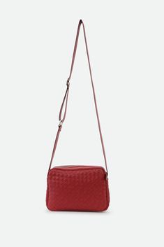 Presenting the Bari Bag—a statement of elegance and timeless charm. With its distinctive woven design and slim silhouette, this bag seamlessly complements any outfit, exuding a sense of relaxed sophistication. Meticulously handcrafted in Italy, using the finest lambskin leather, it epitomizes luxury and quality. Perfect for everyday wear and travel with a zippered closure, the Bari combines style with functionality, ensuring you stand out with every step. Details: Handmade in Italy Crafted from Square Shoulder Bag With Intrecciato Weave For Travel, Intrecciato Weave Shoulder Bag For Business, Classic Bags With Interwoven Design For Everyday Use, Elegant Woven Leather Shoulder Bag For Travel, Elegant Woven Crossbody Shoulder Bag, Classic Evening Bags With Braided Handles, Modern Shoulder Bag With Interwoven Design, Classic Intrecciato Weave Shoulder Bag For Everyday, Classic Intrecciato Shoulder Bag For Everyday