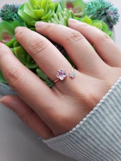 "Bubble Sakura Wrap Band Ring Band Width: 1/16\" (0.1 cm) to 5/16\" (1.0 cm) can also go wider depends on how you want to style the ring. Will fit 5.5 to 8.5 US ring size Weight: 2g Material: Rhodium or Rose Gold plated over brass, cubic zirconia Note: Please stretch the ring out with care. Do it slowly to get to the size that you need. Too much force would put stress on it and snap. To make it smaller just pitch it together." Sakura Engagement Ring, Delicate Pink Stackable Rings For Gifts, Adjustable Open Flower Ring Fine Jewelry, Dainty Pink Solitaire Ring, Dainty Pink Flower Promise Ring, Pink Dainty Birthstone Promise Ring, Dainty Pink Birthstone Promise Ring, Adjustable Pink Flower Ring For Anniversary, Pink Adjustable Fine Jewelry Ring