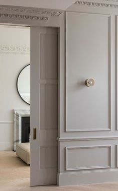 an open door leading to a white room