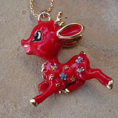 This Whimsical Necklace Is Brand New But Designed To Look Vintage. It Features A Red Enamel Reindeer Pendant. This Adorable Deer Charm Measures About 1.75" In Length And Stands 2" Tall. It's Adorned With Small Gold Tone Daisy Flowers, Some Of Which Are Decorated With Tiny Rhinestone Jewels. The Pendant Hangs From A 28" Gold Colored Chain And Comes With A 2" Extension. The Necklace Is Finished With A Lobster Style Clasp. Brand New, Never Been Worn. Cute Red Necklace For Parties, Whimsical Red Party Jewelry, Jewel Winter, Whimsical Necklace, Holiday Necklace, Daisy Flowers, Look Vintage, Festive Holiday, Daisy Flower