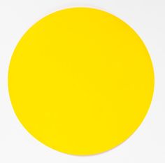 a yellow circle on a white surface with no background or image in the middle,