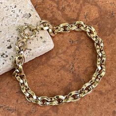 14KT yellow gold knife-edge, oval, interlocking chain link bracelet with toggle clasp. Great, chunky links bracelet to wear on its own or with an arm full of bracelets! Length: 8" Chain width: 7.95mm Weight: 9.25 grams Stamped 14K Easy to use toggle clasp Made in Italy Classic Gold Chunky Chain Bracelet, Gold Oval Metal Chain Bracelet, Classic Chain Bracelet With Chunky Oval Links, Oval Gold Metal Chain Bracelet, Gold-tone Oval Link Bracelet, Classic Chunky Chain Bracelet With Oval Links, Gold Oval Chain Bracelet, Formal Gold Bracelet With Chunky Chain, Gold-tone Gold Bracelet With Chunky Oval Link Chain