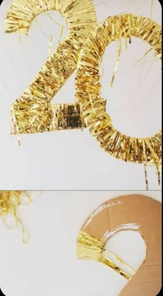 the number twenty is made out of gold tinsel