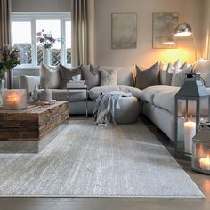 a living room filled with furniture and candles