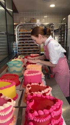 a woman working in a bakery making cakes