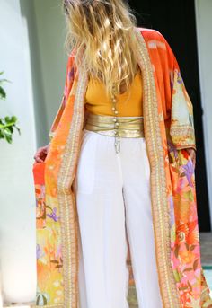 If you love kimonos, flowers, the color orange and mermaids this kimono has your name on it! A  beautifully designed with free flowing winged arms with an intrigue inspired mermaid theme. Three-quarter inch flare sleeves. Poly blend.   SizeSleeveBustLengthShoulder S3213013463 M3213413564 L3213813665 The Color Orange, Flower Kimono, 2piece Outfits, Bohemian Kimono, Orange Satin, Orange Outfit, Satin Kimono, Mermaid Inspired, Flare Sleeves