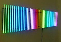 a colorful light is shining brightly on the wall