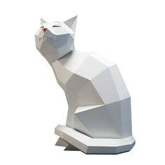 a white cat statue sitting on top of a table