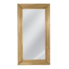 a wooden framed mirror on a white wall with a light brown frame and wood trim