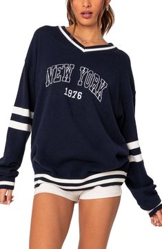 Enjoy Big Apple energy in this varsity sweater designed with dropped shoulders and contrasting stripes. V-neck Long sleeves Ribbed cuffs and hem 100% acrylic Hand wash, dry flat Imported New York Sweater, New York Sweatshirt, Oversized Sweater Women, Collar Cardigan, Cardigan Vest, Warm Coat, Sweater Design, Knit Pants