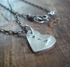 "Sweethearts" My hand crafted fine silver heart charm floats freely on a string of elongated cable chain & is personalized with your choice of letters.. *** PLEASE NOTE due to the customized nature of this piece it is not returnable. COMPONENTS: ~14mm recycled fine silver (99% pure silver/ sterling is 92.5% silver) heart charm that I have constructed entirely by hand! Size is approximate since these are made one at a time. Sterling silver elongated cable chain. All metal components are high qual Heart Charm Necklace, Gold Bond, Silver Heart, Fine Silver, Pure Silver, Heart Charm, Cable Chain, Handmade Necklaces, Dog Tag Necklace