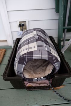 an open suitcase sitting on top of a wooden floor next to a white wall and door